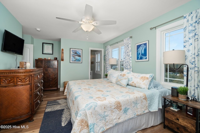 bedroom with ceiling fan and wood finished floors