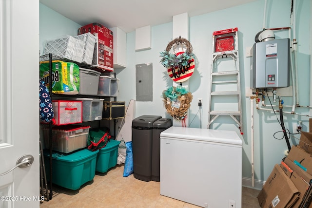 clothes washing area featuring electric panel and tankless water heater