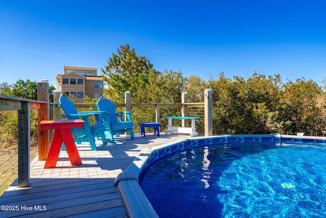 outdoor pool featuring a deck