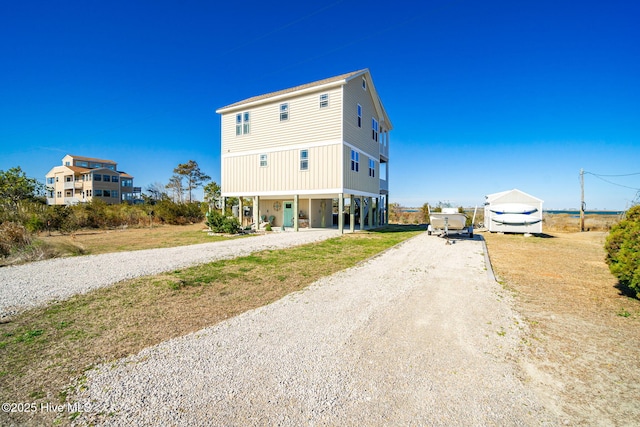 view of road with gravel driveway