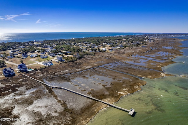 drone / aerial view with a water view and a view of the beach