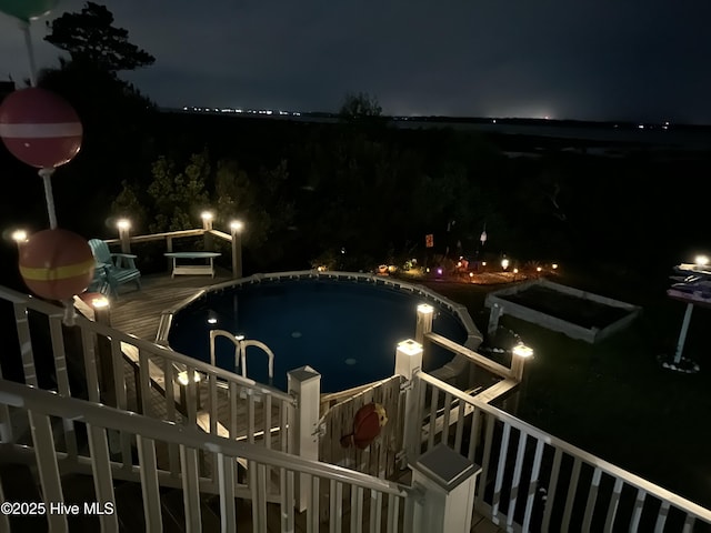 view of pool at night
