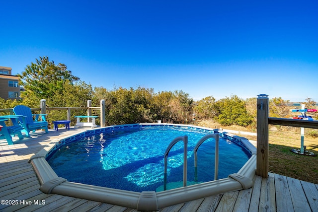 pool with a wooden deck