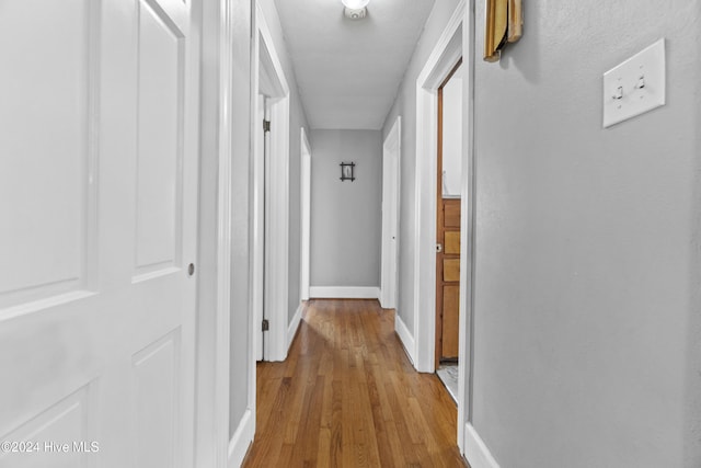 corridor featuring light hardwood / wood-style flooring