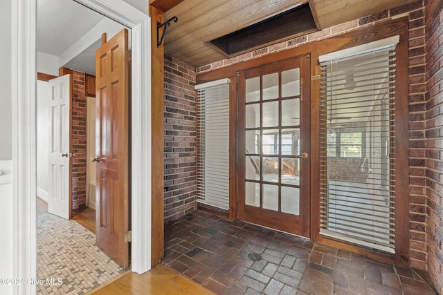 doorway to outside with brick wall