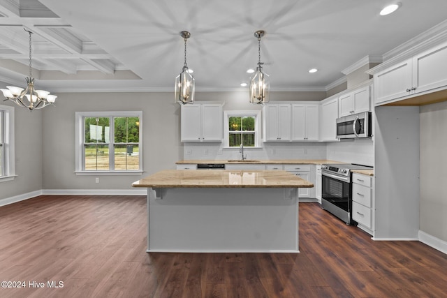 kitchen featuring coffered ceiling, sink, light stone counters, white cabinetry, and stainless steel appliances