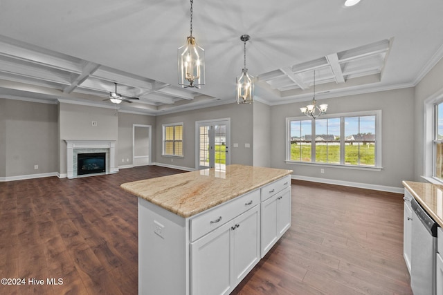 kitchen featuring white cabinets, decorative light fixtures, a fireplace, and coffered ceiling