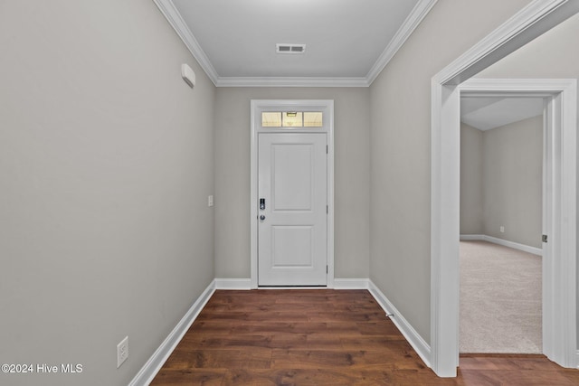 doorway with crown molding and dark wood-type flooring