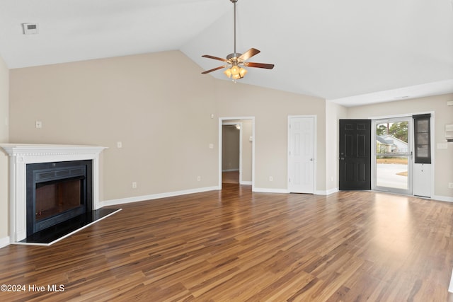 unfurnished living room featuring ceiling fan, wood-type flooring, and vaulted ceiling