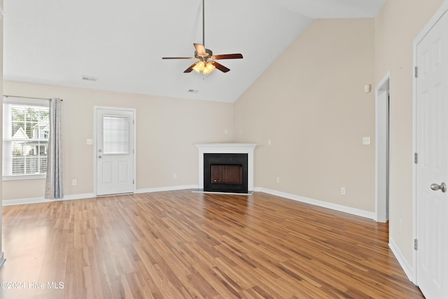 unfurnished living room featuring ceiling fan, high vaulted ceiling, and light hardwood / wood-style flooring