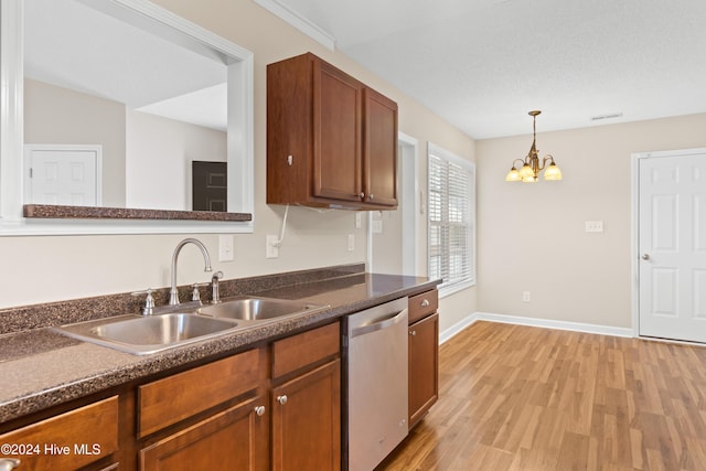 kitchen featuring sink, hanging light fixtures, an inviting chandelier, stainless steel dishwasher, and light hardwood / wood-style floors