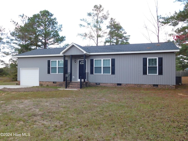 12521 Mckinnon Dr, Laurinburg, NC 28352 - ranch-style house with crawl space, a garage, roof with shingles, and a front lawn