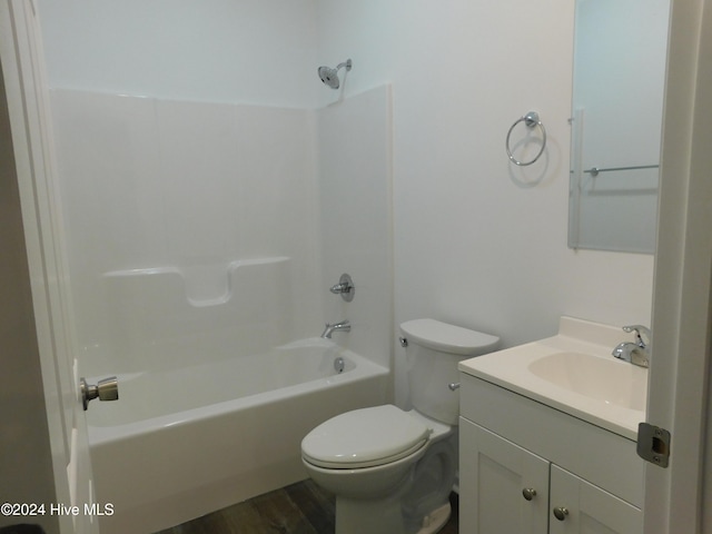 full bathroom featuring bathtub / shower combination, hardwood / wood-style floors, vanity, and toilet