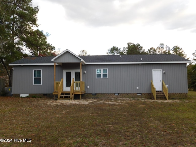 12521 Mckinnon Dr, Laurinburg, NC 28352 - back of house featuring crawl space, entry steps, and a shingled roof