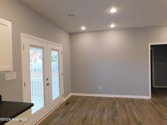 doorway to outside with french doors and dark wood-type flooring