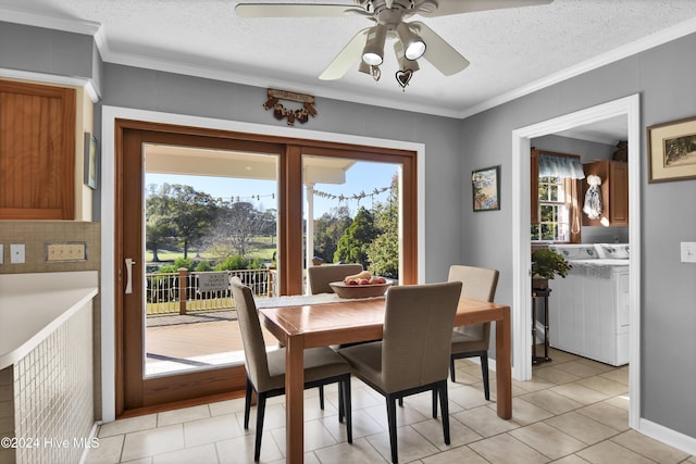 tiled dining area with a textured ceiling, plenty of natural light, and crown molding