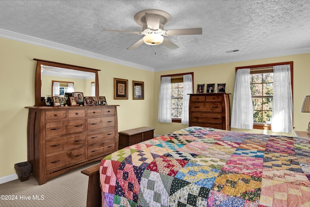 carpeted bedroom with ceiling fan, a textured ceiling, and ornamental molding