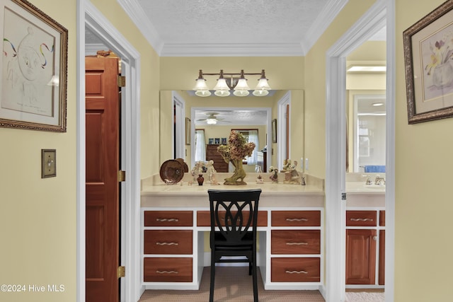 bathroom with vanity, a textured ceiling, ceiling fan, and crown molding