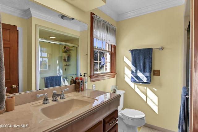 bathroom featuring vanity, toilet, an enclosed shower, and ornamental molding