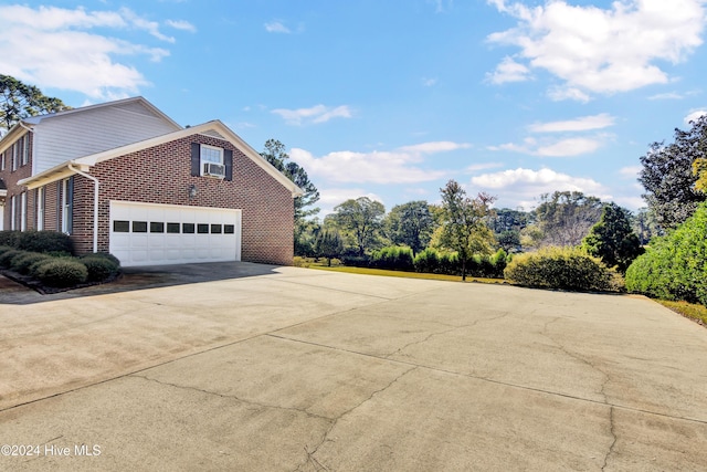 view of side of property with a garage