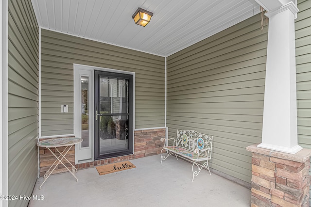 doorway to property featuring covered porch