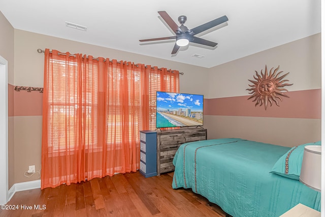 bedroom featuring hardwood / wood-style flooring and ceiling fan