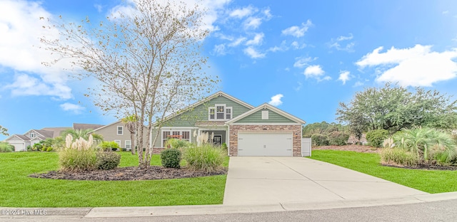 view of front of house with a garage and a front lawn