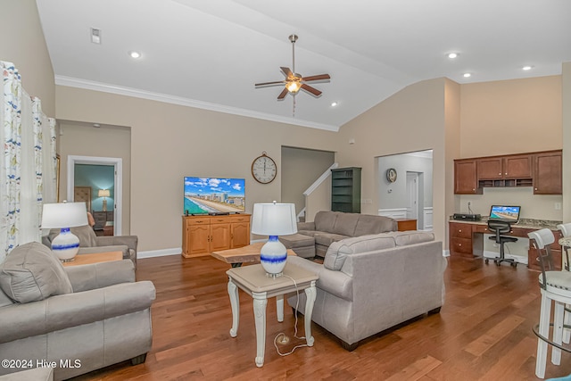 living room with ceiling fan, crown molding, built in desk, and wood-type flooring