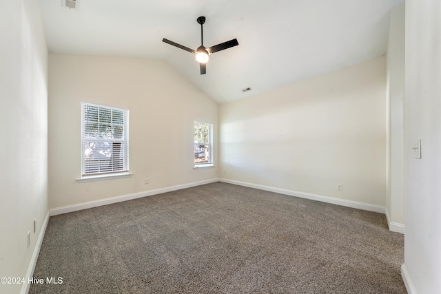 empty room featuring carpet, vaulted ceiling, and ceiling fan