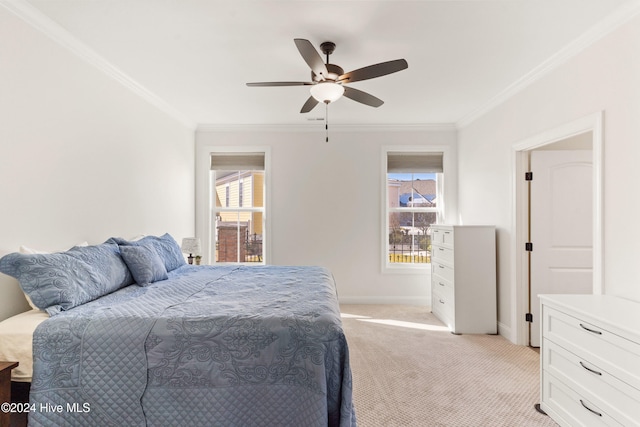 carpeted bedroom featuring multiple windows, crown molding, and ceiling fan