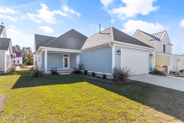 view of front of house featuring a front yard and a garage