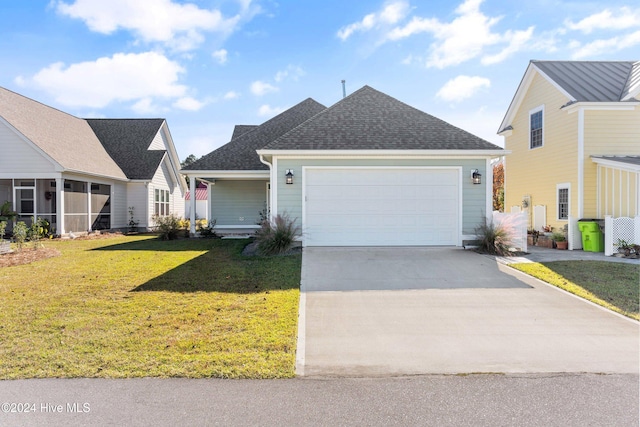 view of front of house featuring a front lawn and a garage