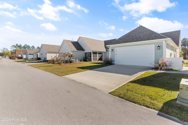 view of front facade featuring a front yard and a garage