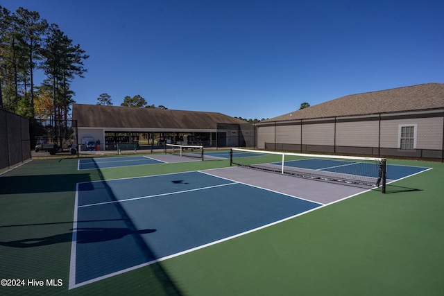 view of sport court featuring basketball hoop