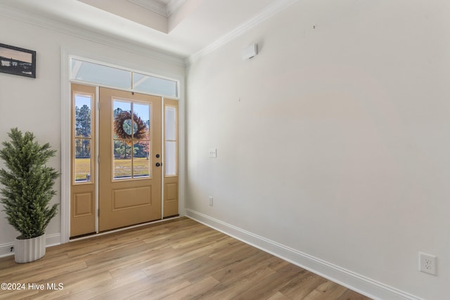 foyer featuring light hardwood / wood-style floors and crown molding