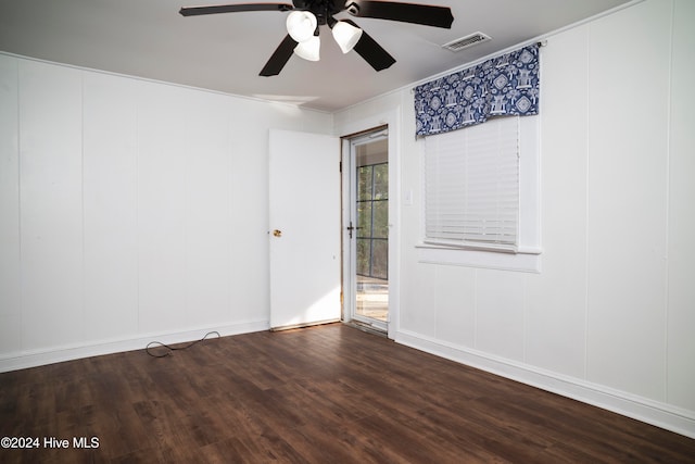 spare room with hardwood / wood-style floors, ceiling fan, and crown molding