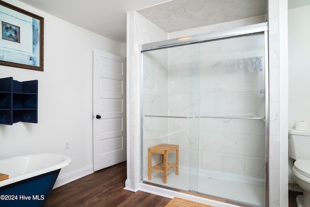 bathroom with toilet, wood-type flooring, and independent shower and bath