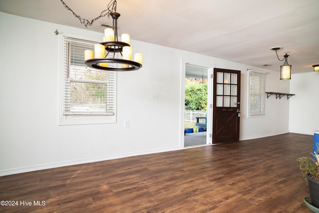 entryway with dark hardwood / wood-style flooring