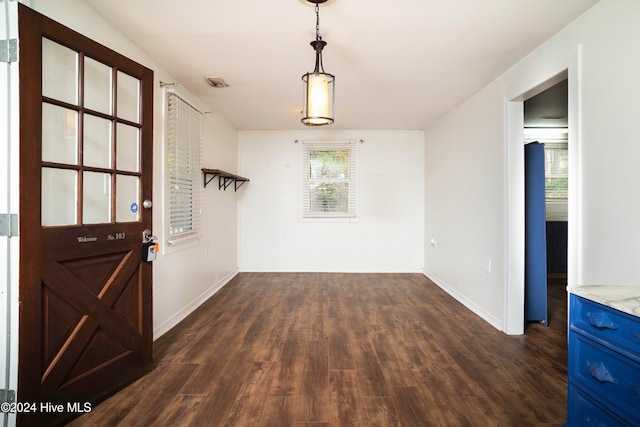 interior space with dark hardwood / wood-style flooring