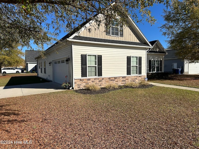 view of property exterior featuring a garage and a yard