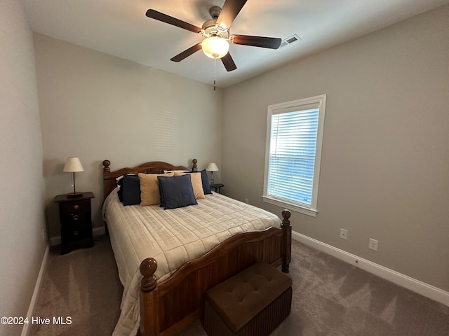 bedroom featuring ceiling fan and dark colored carpet