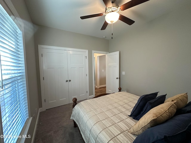 bedroom featuring a closet, dark carpet, and ceiling fan