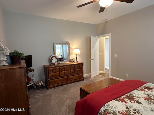 bedroom with ceiling fan and carpet floors