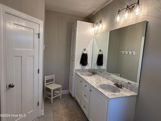 bathroom with tile patterned floors and vanity