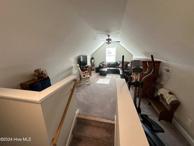 carpeted bedroom featuring ceiling fan and vaulted ceiling