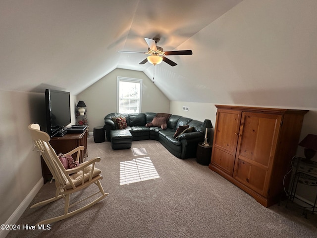 carpeted living room featuring ceiling fan and lofted ceiling