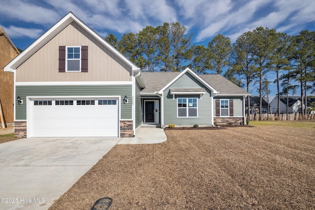 craftsman house with a garage and a front yard