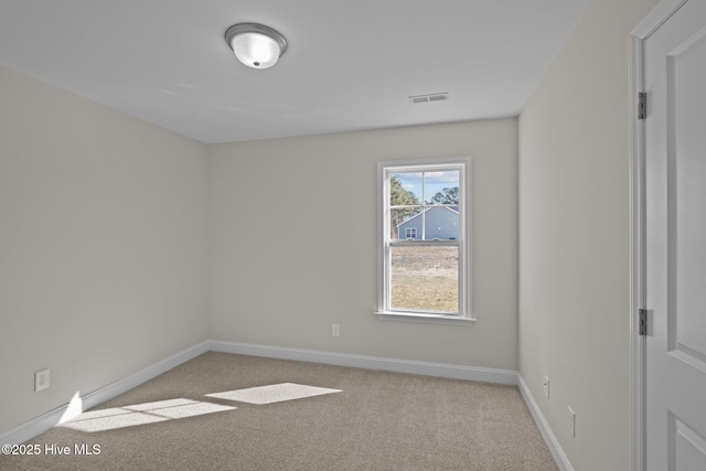 empty room with light colored carpet