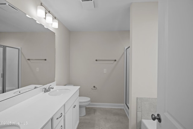 bathroom with toilet, an enclosed shower, and vanity