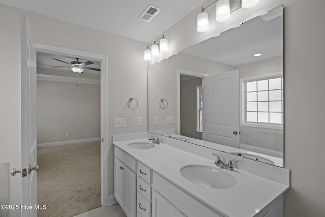 bathroom featuring ceiling fan and vanity